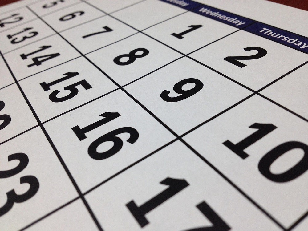 A large calendar with black date numbers. The days of the week are at the top