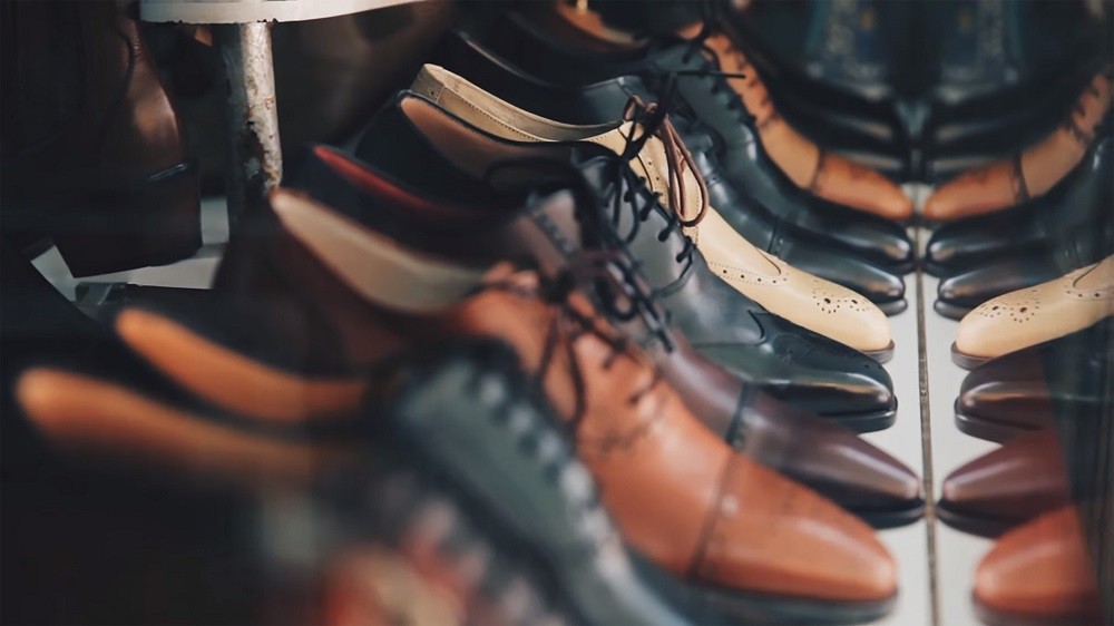 Several pairs of dress shoes in colours ranging from light brown to medium, and dark brown, and black are pictured