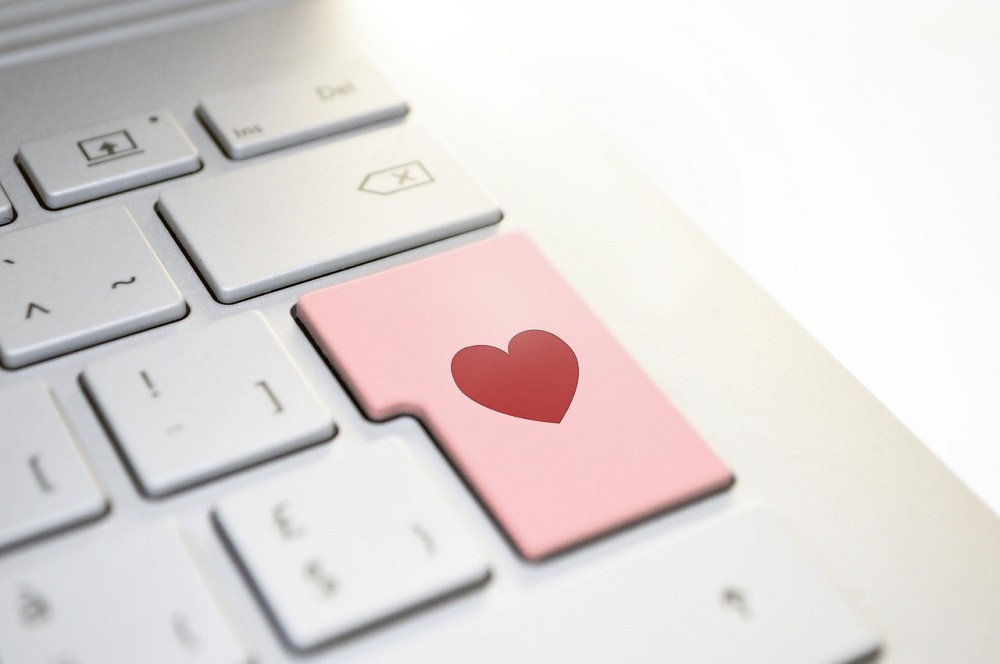 The enter button on a keyboard is replaced with one that has a heart