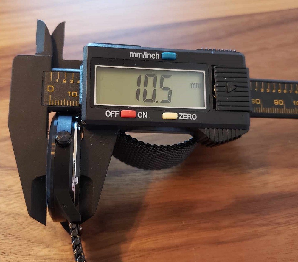 Calipers are used to measure the thickness of the Frank Forta Moraine Lake watch. The measurement on the calipers show 10.5mm