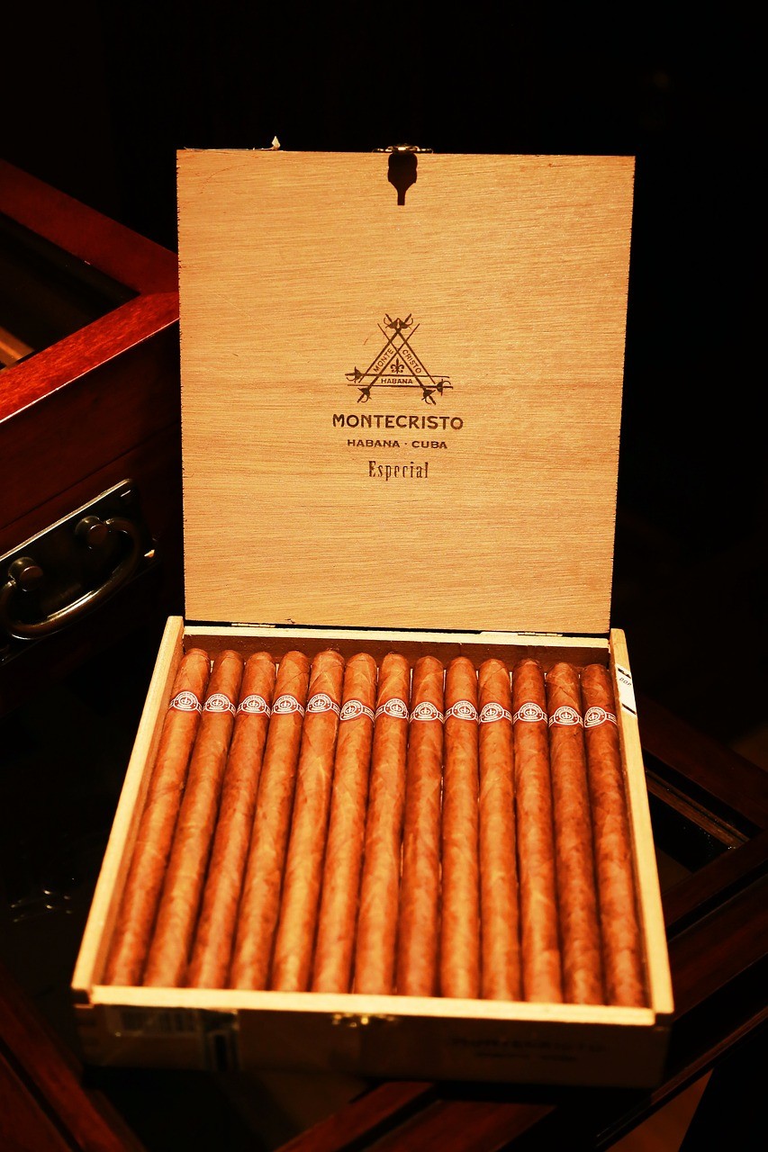 A box of long, slim Montecristo cigars sit neatly inside the box they were shipped in