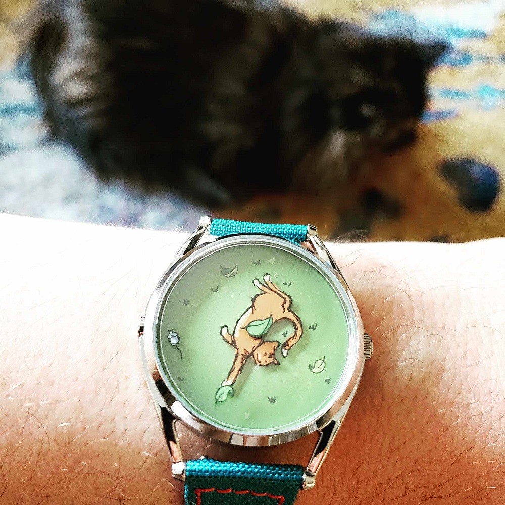 Mr Jones Watches Mispoes! watch on a wrist with a teal blue strap
