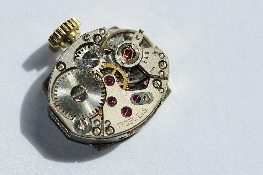 A movement from a vintage mechanical watch. The gears and springs are clearly visible