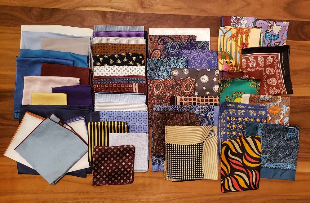 A wide array of pocket square styles ranging from plain solid colours to intricate designs with multiple colours