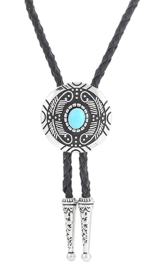 A bolo tie is shown. It has a black leather strap, a silver and black decorative emblem with a teal blue stone in the middle