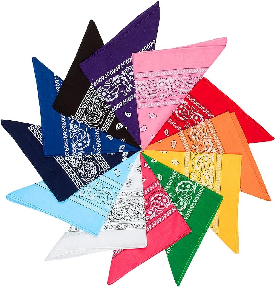 An array of bandanas are laid out in a circle. All of them have a white paisley pattern. They range from dark blues and blacks to bright yellows, oranges, and pinks