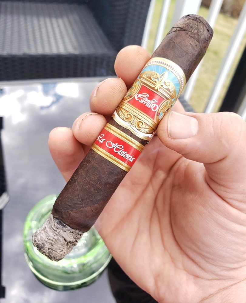 The La Historia EP Carrillo cigar is lit and holds about half an inch of ash on the end