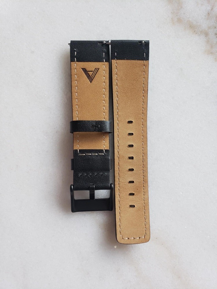 The watch strap that comes with the Esteemed Gentleman vinyl record watch is made of genuine leather. It is black on one side and medium brown on the other
