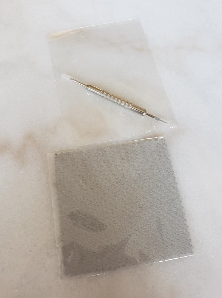 A watch strap changing tool and small grey polishing cloth come in clear plastic bags. Extra gifts when you purchase a Northern Star Watch
