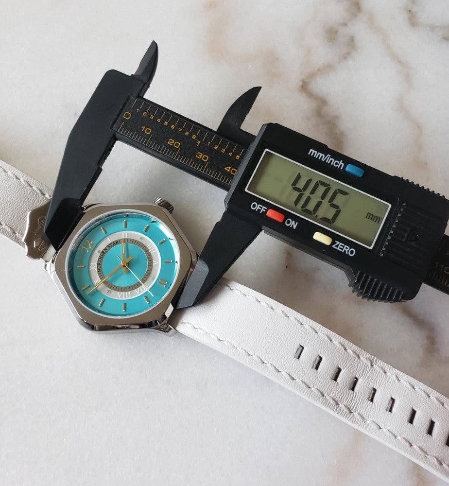 A digital watch caliper is used to measure the diameter of the Icy Sentinel by Northern Star Watch. The diameter is 40.5mm displayed on the calipers screen