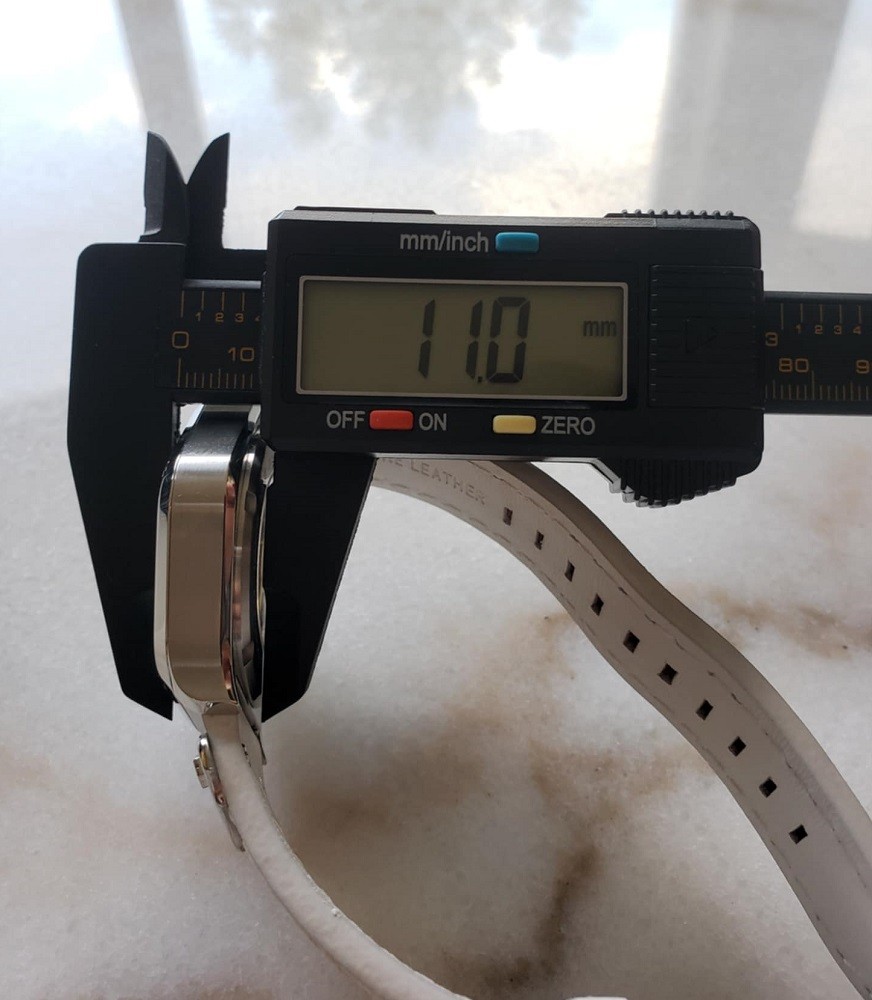A digital watch caliper is used to measure the thickness of the Icy Sentinel by Northern Star Watch. The thickness is 11mm displayed on the calipers screen