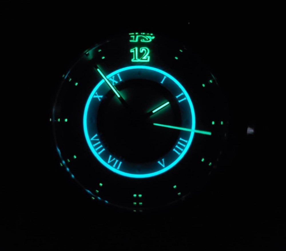 In the dark the Icy Sentinel watch by Northern Star Watch features both blue and green lume used to illuminate important parts of the watch like the hour, minute, and second hands along with a chapter ring that denotes the hour markers on the watch