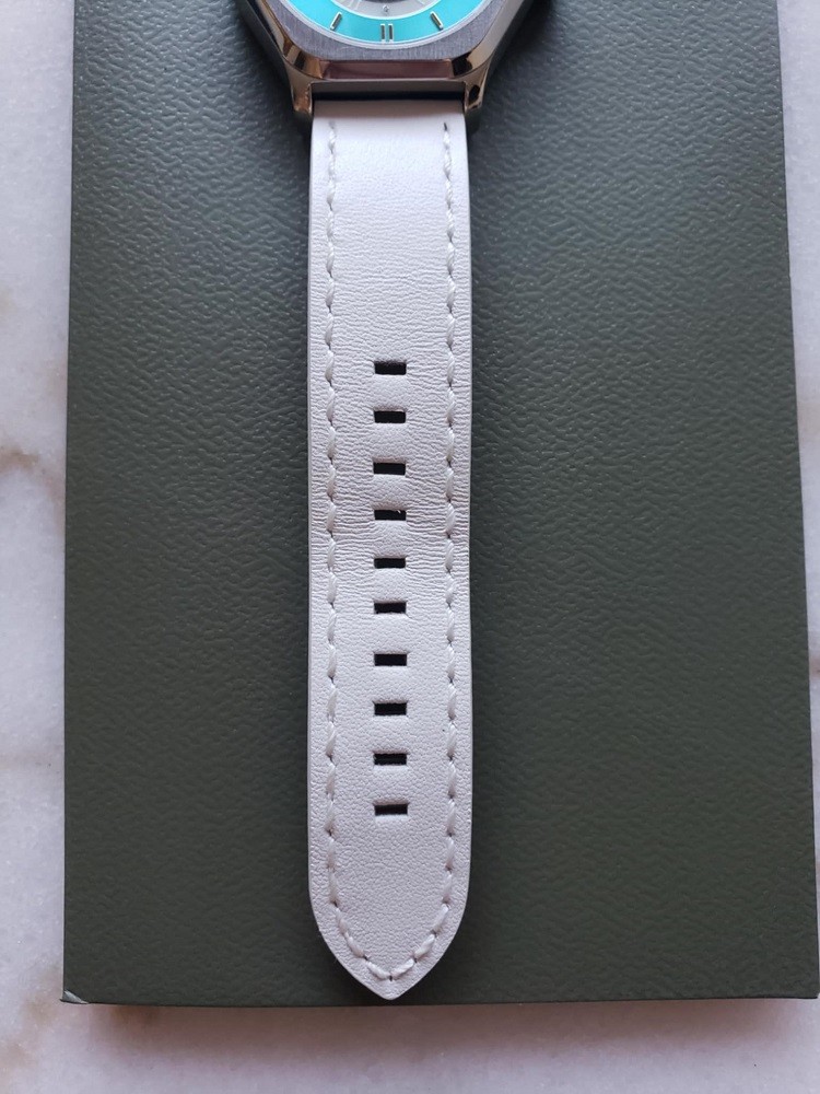A white leather strap comes with the Sentinel watch by Northern Star Watch. It features white stitching around the border of the strap
