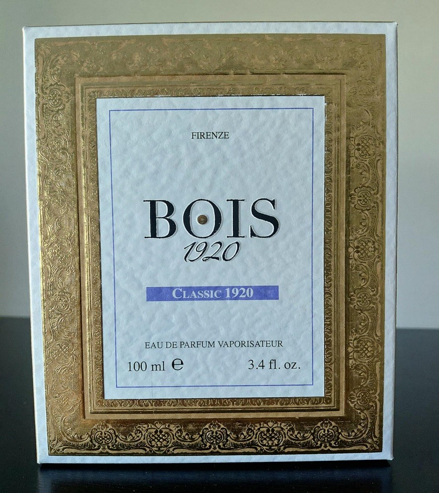 The front of the box of Classic 1920 fragrance by Bois 1920 features a large gold border like what you would see on a picture frame. Inside the border is the name of the fragrance and the brand on a white background