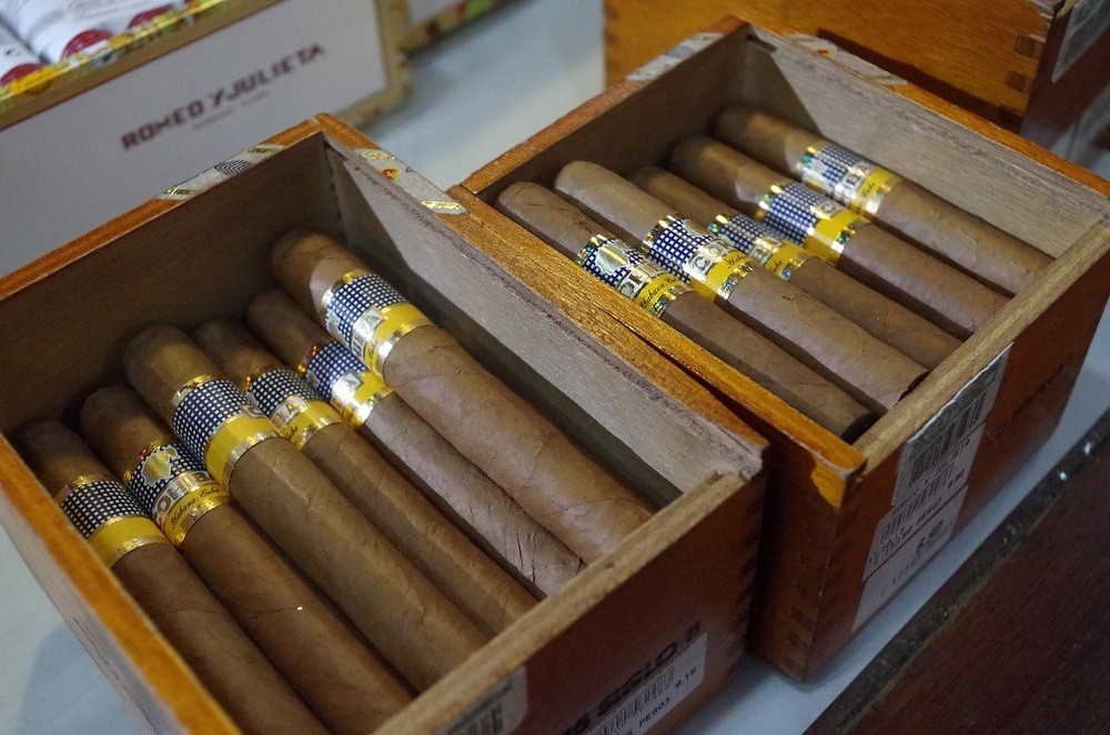 Two boxes of light brown Cuban cigars