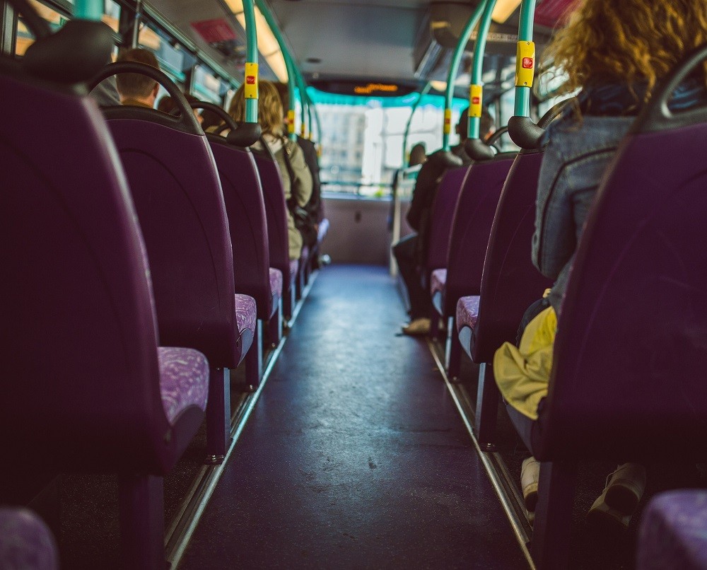 Passengers are seated while riding a bus