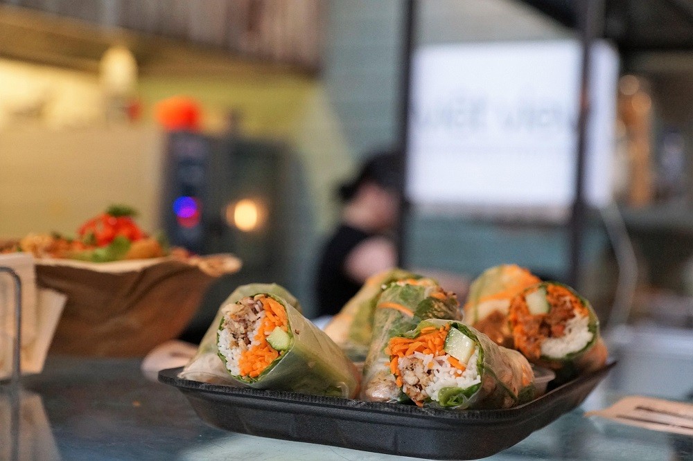 Fresh-made tortilla wraps on a black tray