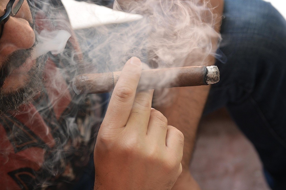 A man smoking a cigar