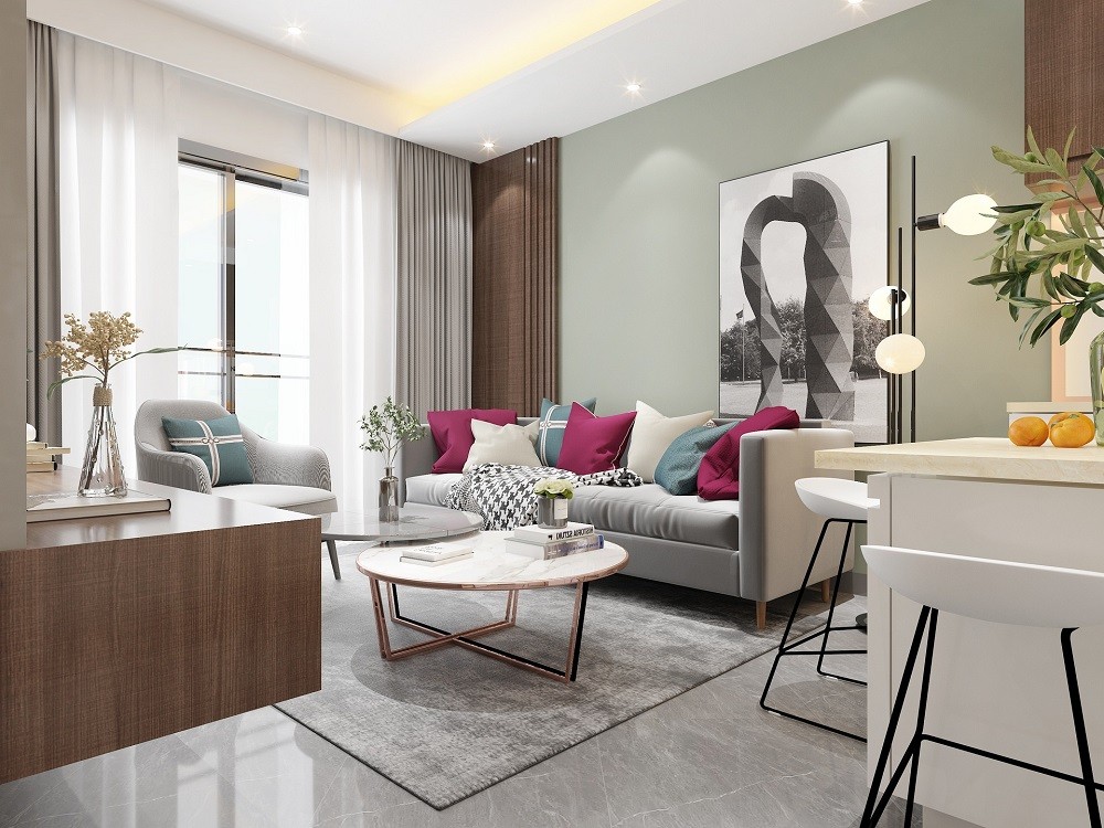 A living room mostly white and chocolate brown with red and blue accent pillows