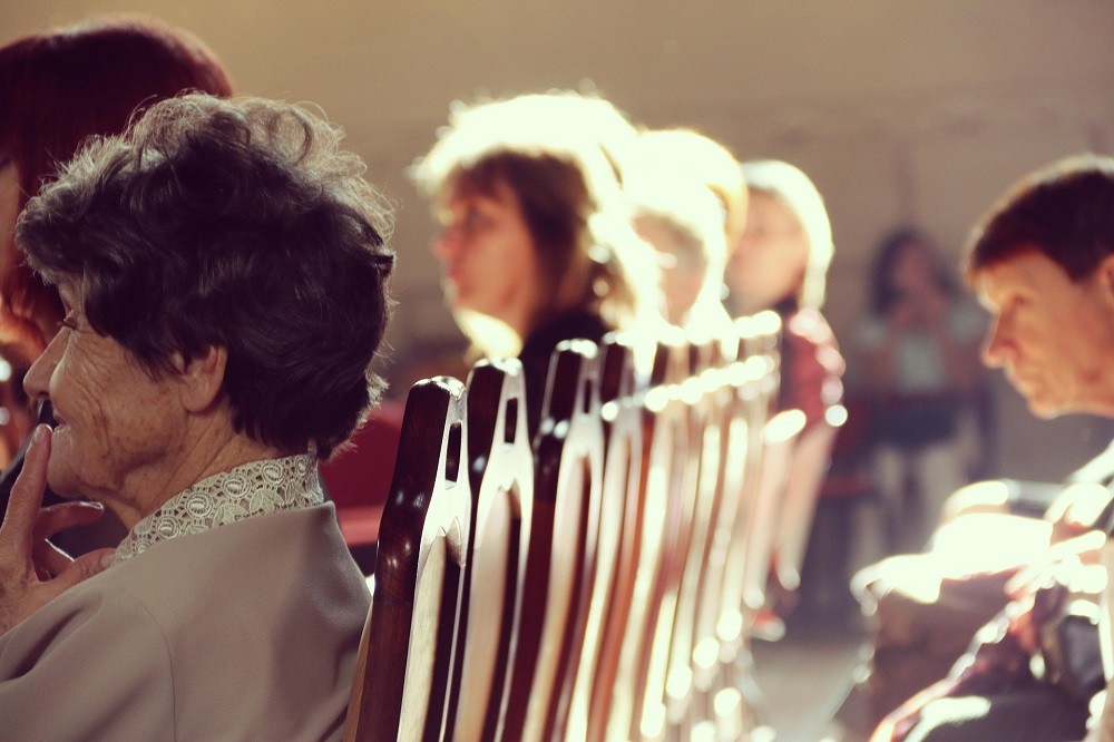 Churchgoers are seated during a service