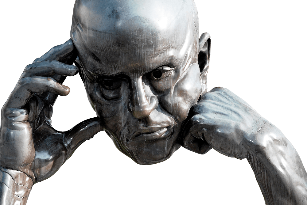A sculpture of a bald man holding his hands to his forehead, deep in thought